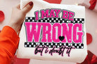 Black graphic tee with white text reading "I May Be Wrong But I Doubt It" from Anchored Grace Boutique, laid flat.