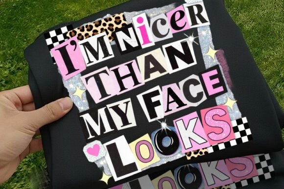 Black graphic tee from Anchored Grace Boutique with bold white text saying "I'm Nicer Than My Face Looks" on the front.