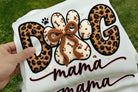 Dog Mama graphic tee from Anchored Grace Boutique, featuring a stylish design and comfortable fit for dog lovers.