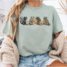 Colorful Snacking Animals graphic tee from Anchored Grace Boutique, featuring playful animal illustrations on a casual tee shirt.