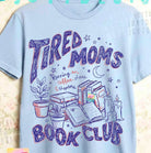 Tired Moms Book Club graphic tee by Anchored Grace Boutique, featuring a casual cotton t-shirt with fun book club print.