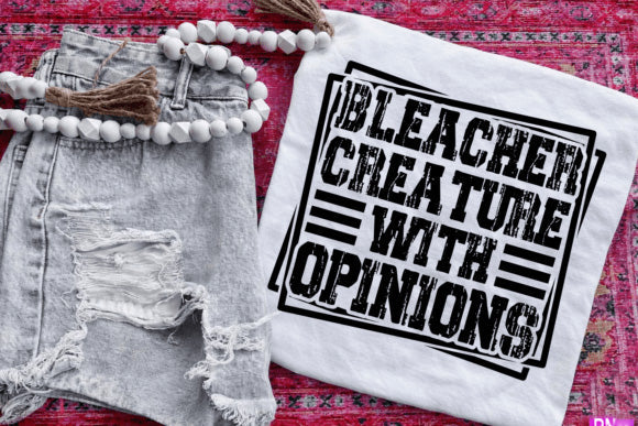 Bleacher Creature with Opinions graphic tee by Anchored Grace Boutique, featuring colorful cartoon character design on a casual shirt.