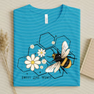 Sweet Like Honey graphic tee by Anchored Grace Boutique, featuring a stylish design on a comfortable cotton shirt.
