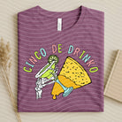 Cinco de Drinko graphic tee by Anchored Grace Boutique featuring colorful festive design and casual fit.