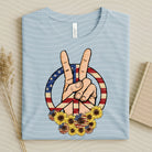 Patriotic Peace graphic tee from Anchored Grace Boutique featuring a star and flag design on soft cotton fabric.