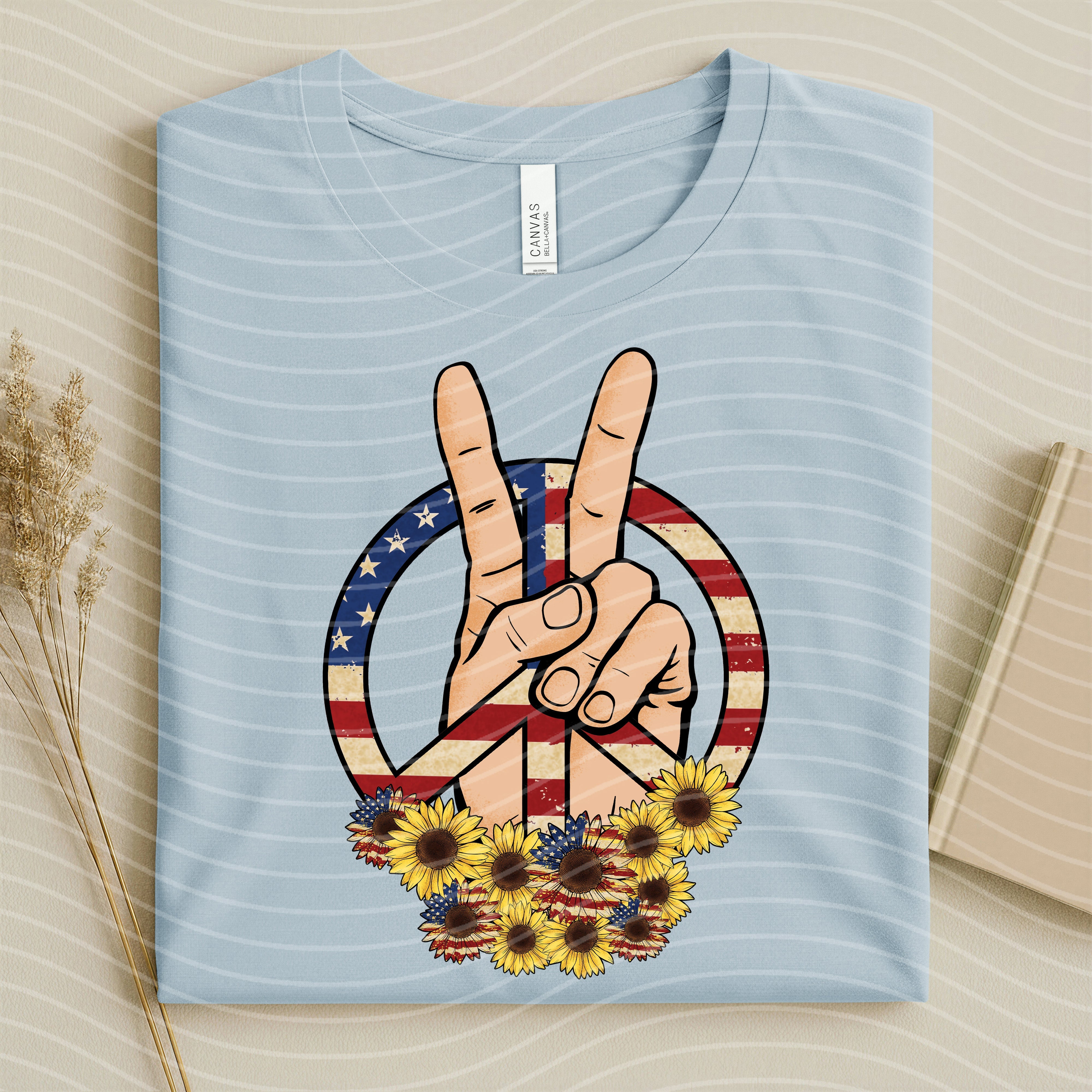 Patriotic Peace graphic tee from Anchored Grace Boutique featuring a star and flag design on soft cotton fabric.