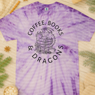 Black graphic tee featuring coffee books and dragons design, by Anchored Grace Boutique. Casual apparel for book and fantasy lovers.