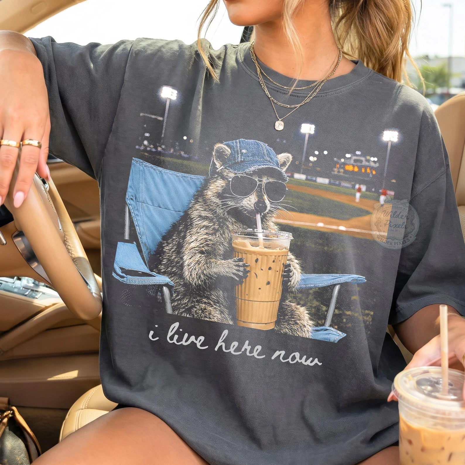 Black I Live Here Now graphic tee by Anchored Grace Boutique featuring bold white text on soft cotton fabric.