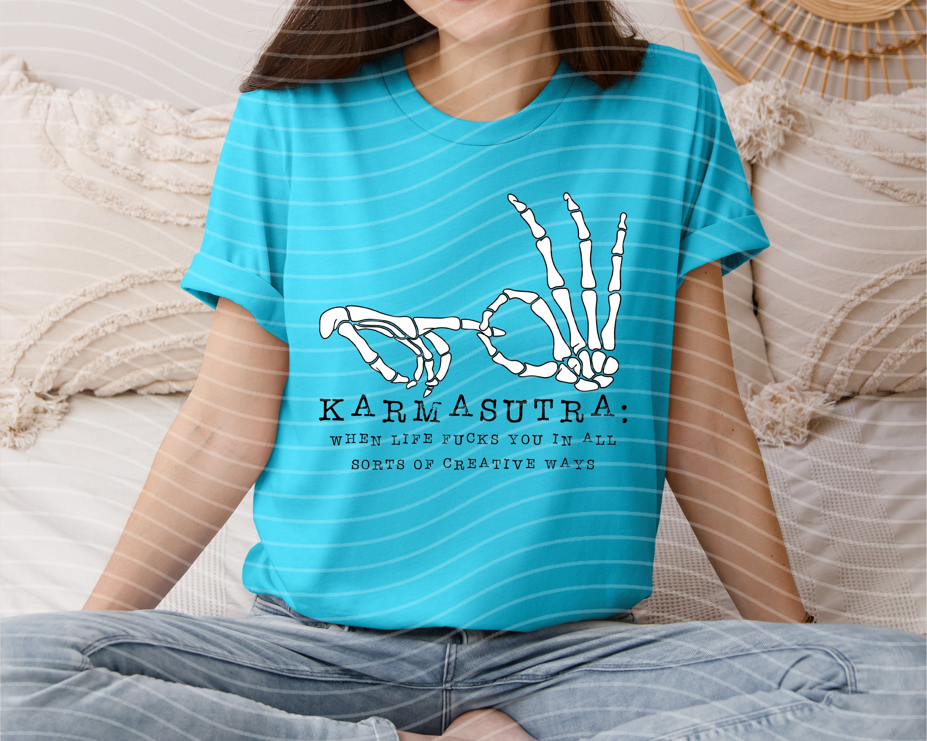 Karmasutra graphic tee by Anchored Grace Boutique featuring bold print and casual fit, displayed on a plain background.