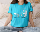 Karmasutra graphic tee by Anchored Grace Boutique featuring bold print and casual fit, displayed on a plain background.