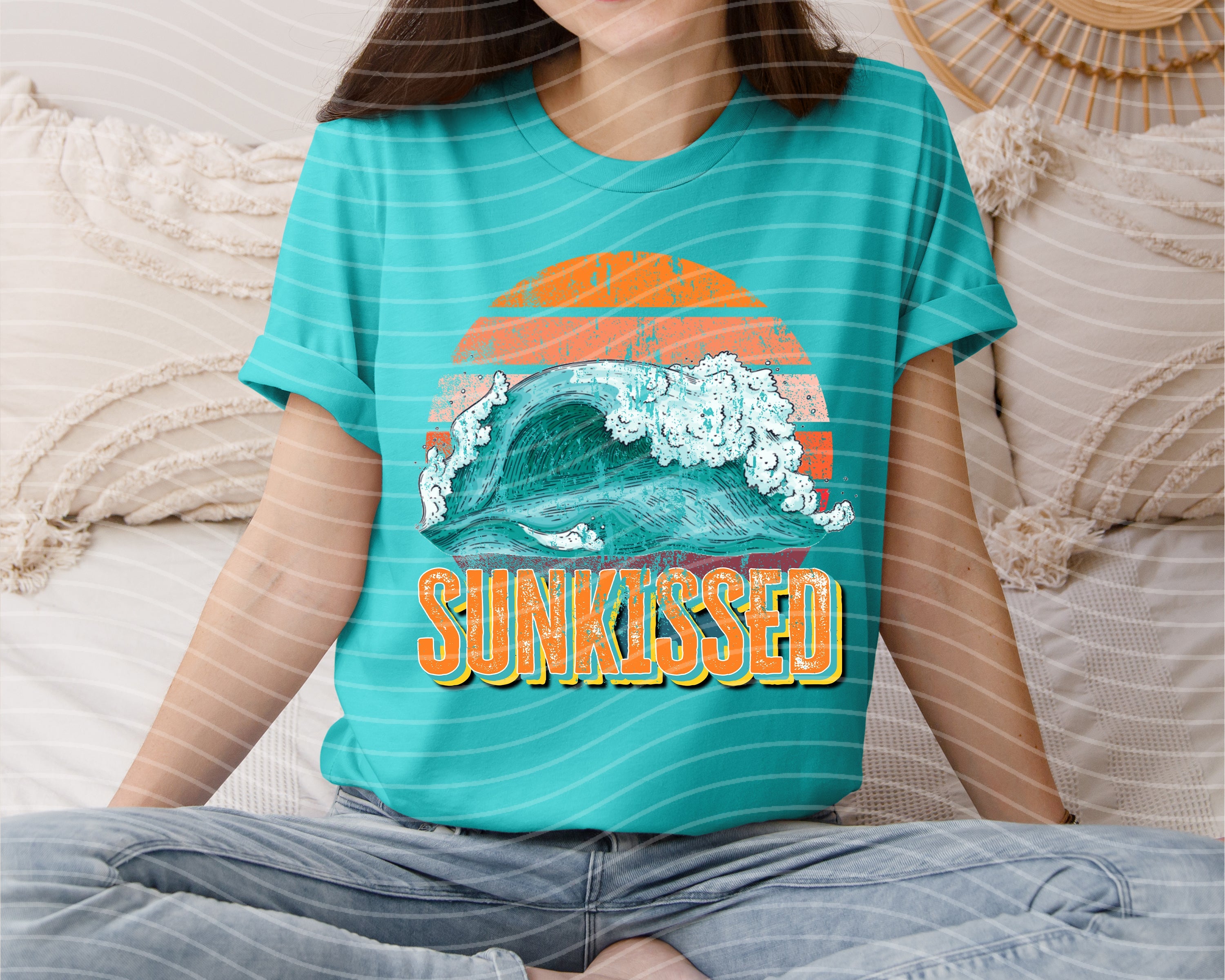 Sunkissed graphic tee from Anchored Grace Boutique featuring a vibrant sun and beach design on a casual cotton t-shirt.