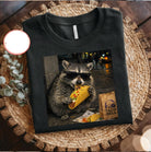 Taco Raccoon graphic tee from Anchored Grace Boutique featuring a playful raccoon and taco design on a casual cotton shirt.
