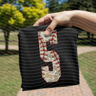 Camo baseball graphic tee with bold numbers from Anchored Grace Boutique, casual streetwear style for men or women.