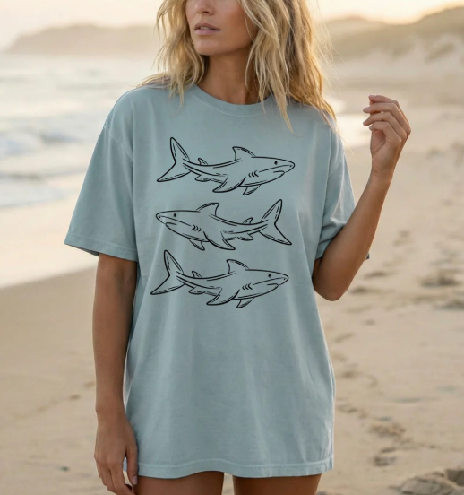 Black Sharks graphic tee from Anchored Grace Boutique featuring a bold shark illustration on soft cotton fabric.