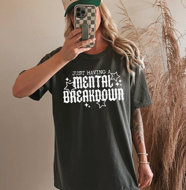 Black graphic tee from Anchored Grace Boutique featuring bold "Just Have a Mental Breakdown" design on front.