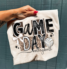 Game Day Volleyball graphic tee by Anchored Grace Boutique, featuring a vibrant volleyball design on a casual cotton shirt.