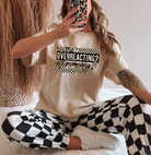 Black graphic tee from Anchored Grace Boutique featuring the phrase "Me Overreacting Probably" in bold white text.