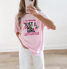 Black graphic T-shirt for women with "I'm Literally Just a Girl" text, from Anchored Grace Boutique.