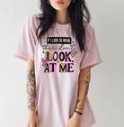 Black graphic tee by Anchored Grace Boutique with bold white text reading "If I Look So Mean Then Don't Look at Me" on the front.