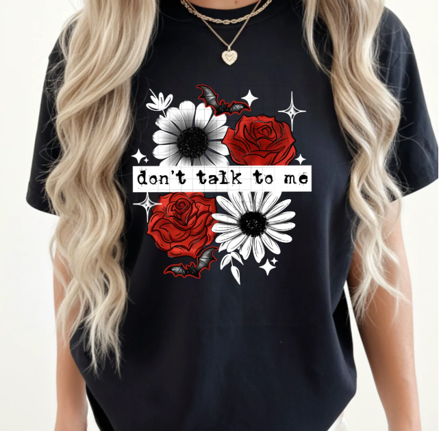 Black graphic tee by Anchored Grace Boutique with bold "Don't Talk to Me" print, casual and stylish for everyday wear.