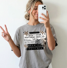 Black graphic tee from Anchored Grace Boutique with white text reading "Actually I Don't Have Anything Nice to Say" displayed on the front.