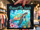 Respect the Locals graphic tee by Anchored Grace Boutique, featuring a stylish design on a casual cotton t-shirt.