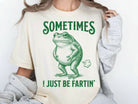 Gray graphic tee by Anchored Grace Boutique featuring humorous "Sometimes I Just Be Fartin" print on soft cotton fabric.