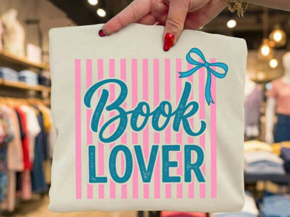 Gray Book Lover graphic tee by Anchored Grace Boutique featuring a book-themed design on soft cotton fabric.