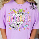 Librarian graphic tee from Anchored Grace Boutique featuring a stylish design with book and reading-themed artwork.