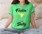 Black Feelin Salty graphic tee by Anchored Grace Boutique featuring a nautical-inspired salty phrase and casual fit.