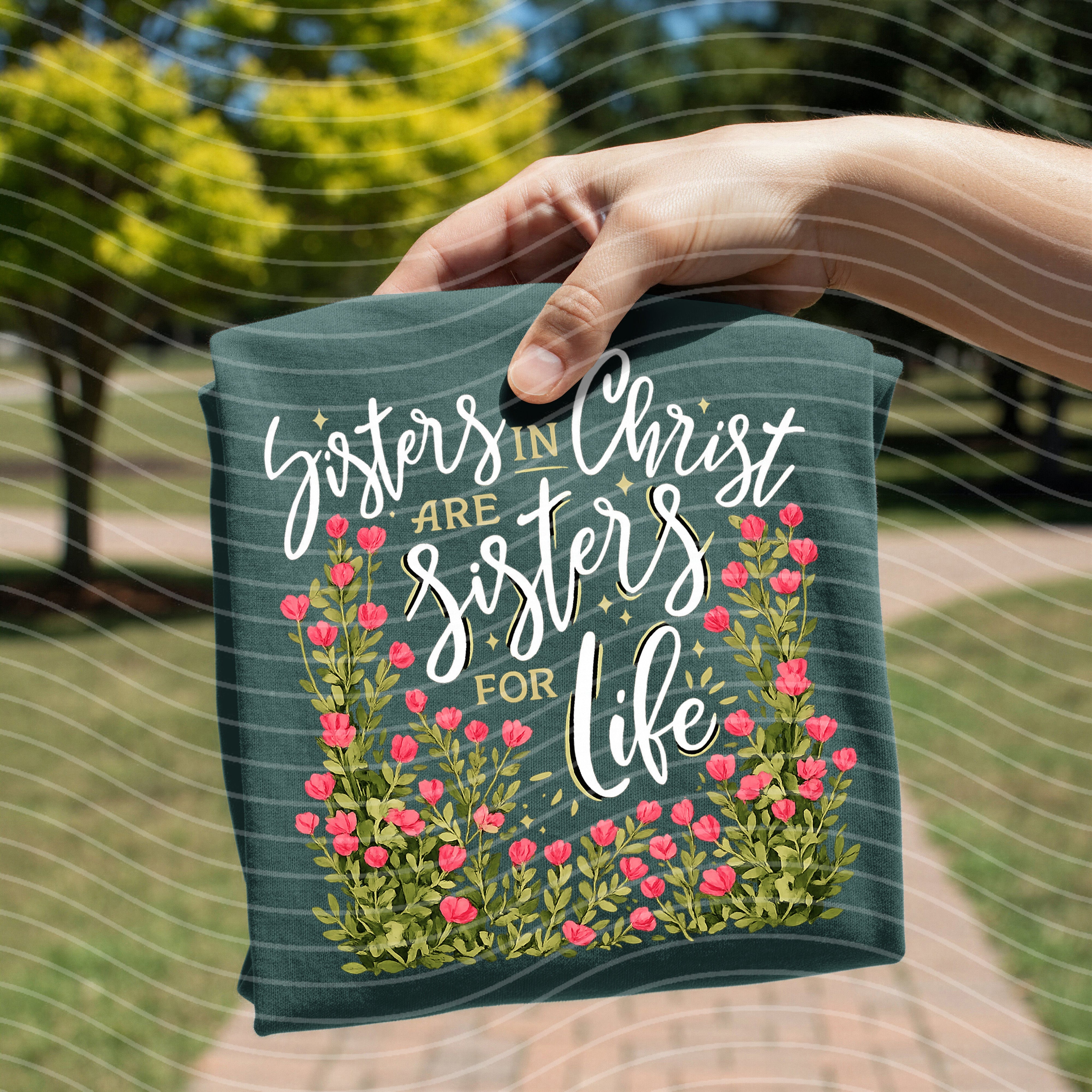 Women wearing Anchored Grace Boutique Sisters in Christ are Sisters for Life graphic tee with faith-inspired design and casual style.