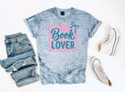 Black Book Lover graphic tee by Anchored Grace Boutique featuring a literary-themed design on a casual cotton t-shirt.