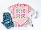 Colorful Granny Squares graphic tee by Anchored Grace Boutique with vibrant square patterns on soft cotton fabric.
