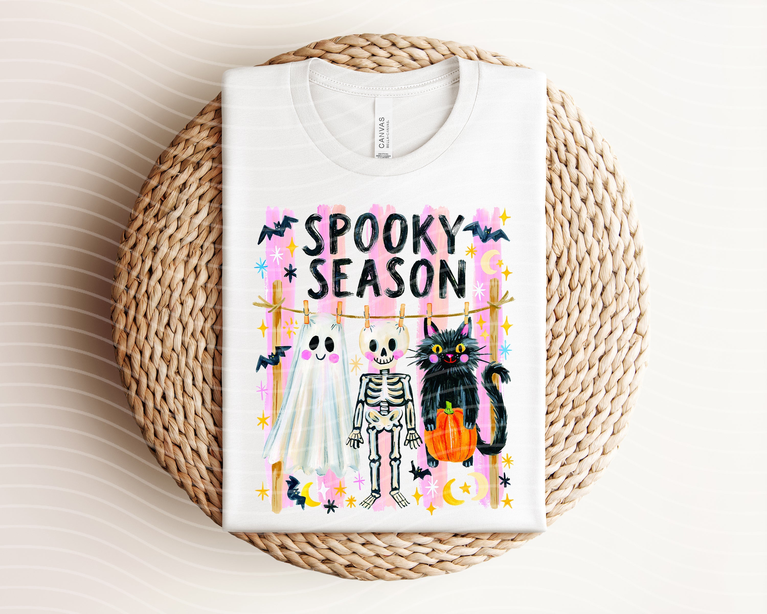 Black Spooky Season graphic tee by Anchored Grace Boutique featuring Halloween-themed design on cotton fabric.