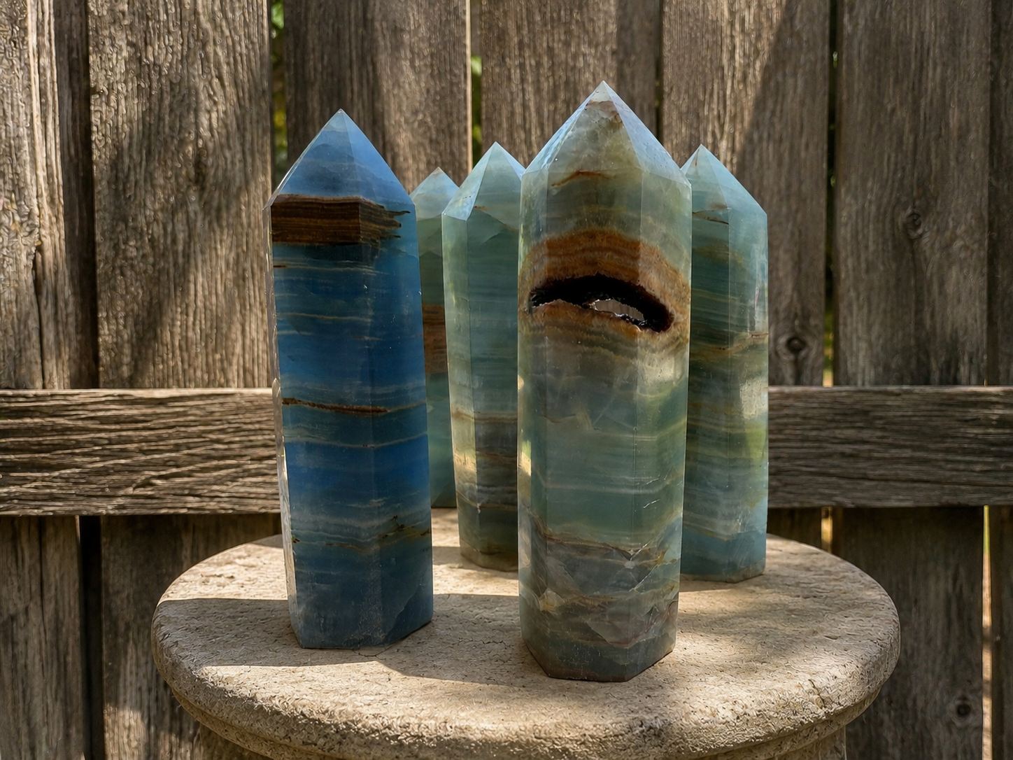 Blue Lemurian Aquatine Onyx tower crystal with deep blue and aquamarine hues, polished and faceted, from Practical Magic Store.