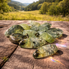 Prehnite with epidote crystal moon pendant featuring green prehnite and epidote mineral details.
