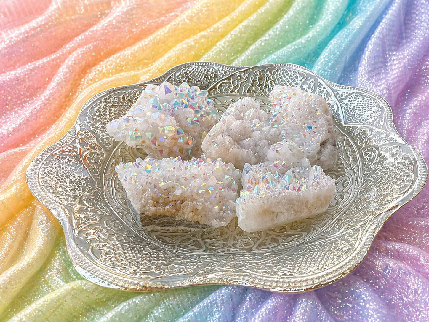 Angel Aura Quartz clusters with iridescent, shimmering crystal formations showcasing vibrant colors and a luminous glow.