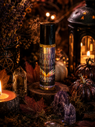 Witchy Woman roll-on perfume oil by 1 Practical Magic Store, featuring a sleek glass bottle with a metal rollerball applicator.