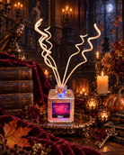 Elegant midnight blue reed diffuser from Practical Magic Store with decorative reeds and enchanted moonlit design.