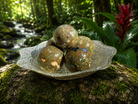 Rainforest Jasper sphere from Practical Magic Store showing vibrant green and brown patterns in polished gemstone.