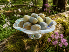 Blue Lemurian Onyx Calcite tumbled stone from Practical Magic Store, smooth blue gemstone with natural patterns and polished surface.