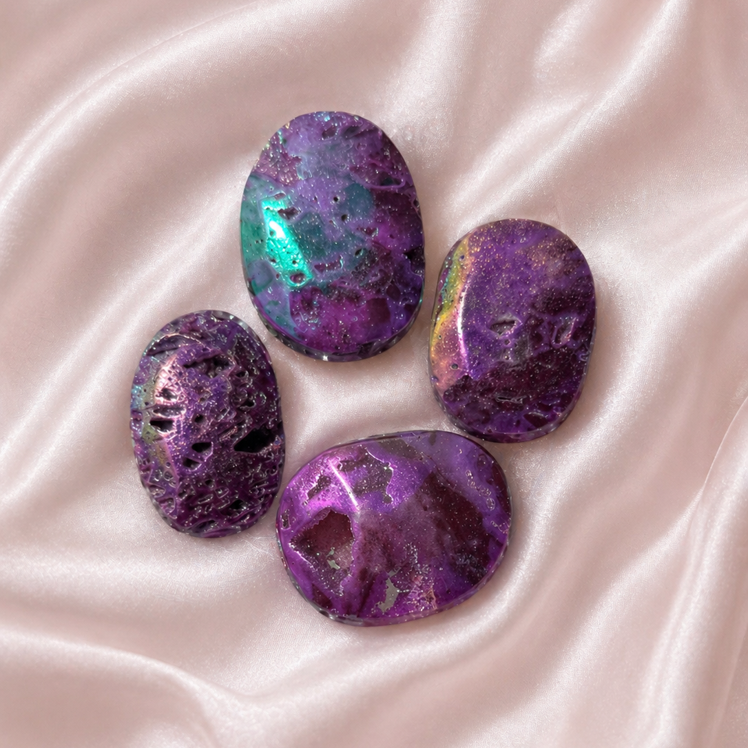 Pink aura druzy sphalerite palmstone from Practical Magic Store, polished pink gemstone with shimmering aura finish, handheld healing stone.