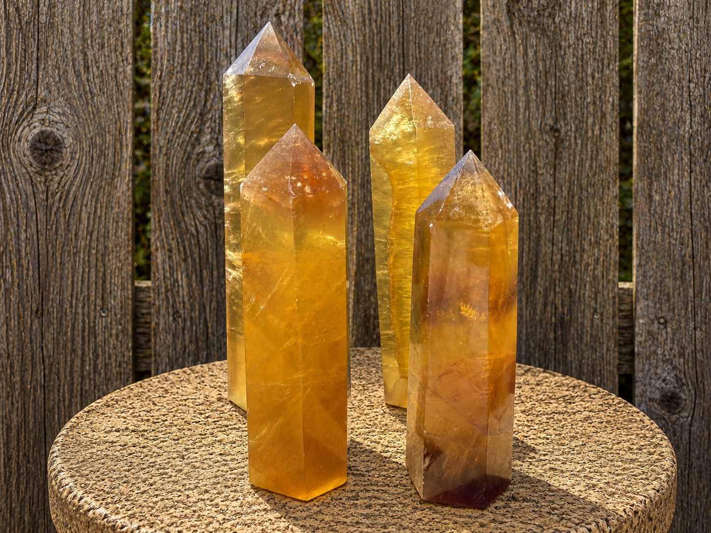 Yellow fluorite tower sculpture from natural stone, showcasing vibrant yellow hues and polished, geometric shape.