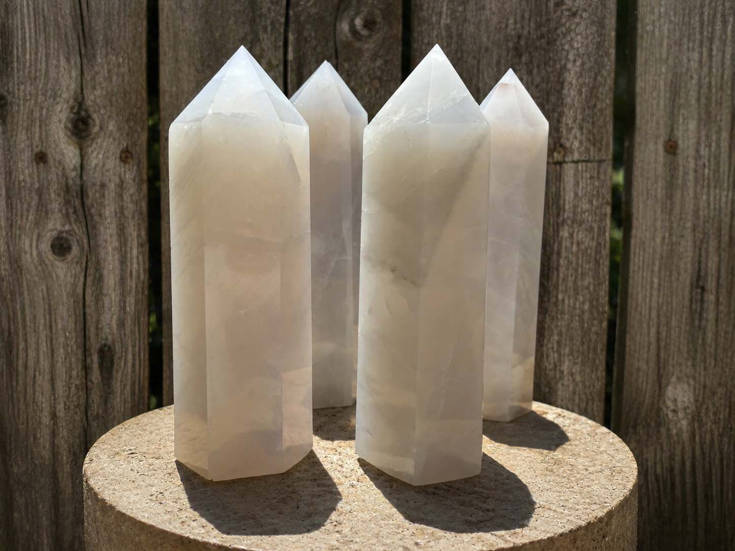 Blue silver rose quartz tower from Practical Magic Store, featuring polished crystal points and a vibrant blue hue.