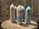 Trolleite Tower from Practical Magic Store, a decorative crystal tower with blue-green trolleite mineral points and natural mineral formations.