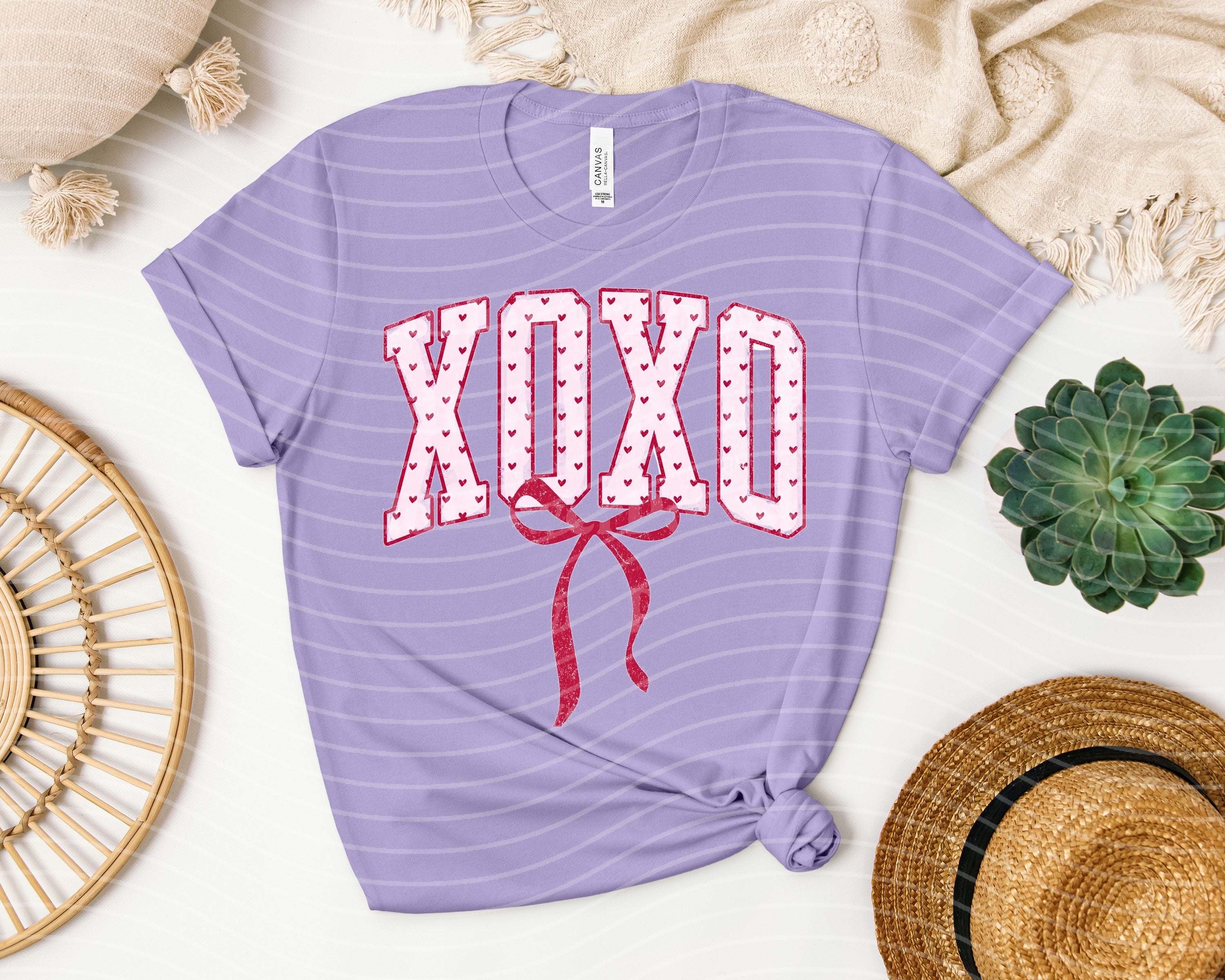 XOXO Coquette graphic tee from Anchored Grace Boutique featuring stylish design and casual fit.
