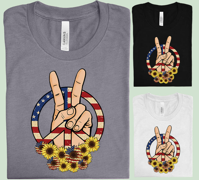 Patriotic Peace graphic tee from Anchored Grace Boutique, featuring a colorful peace sign and American flag design.