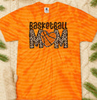 Basketball Mom graphic tee by Anchored Grace Boutique featuring a stylish design on a casual cotton t-shirt.