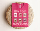 Graphic tee by Anchored Grace Boutique featuring "New Year More Books" design, casual short-sleeve shirt with colorful print.