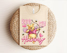 Bee My Hunny graphic tee by Anchored Grace Boutique featuring a colorful honey bee and floral design on soft fabric.